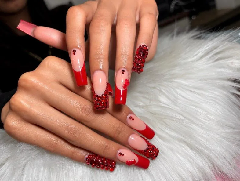 Red glitter French tip nails by Ashley