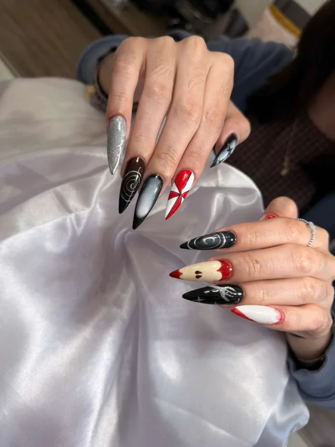 Black and red stiletto nail art by Jessica